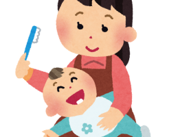 赤ちゃんの歯磨きをするママ